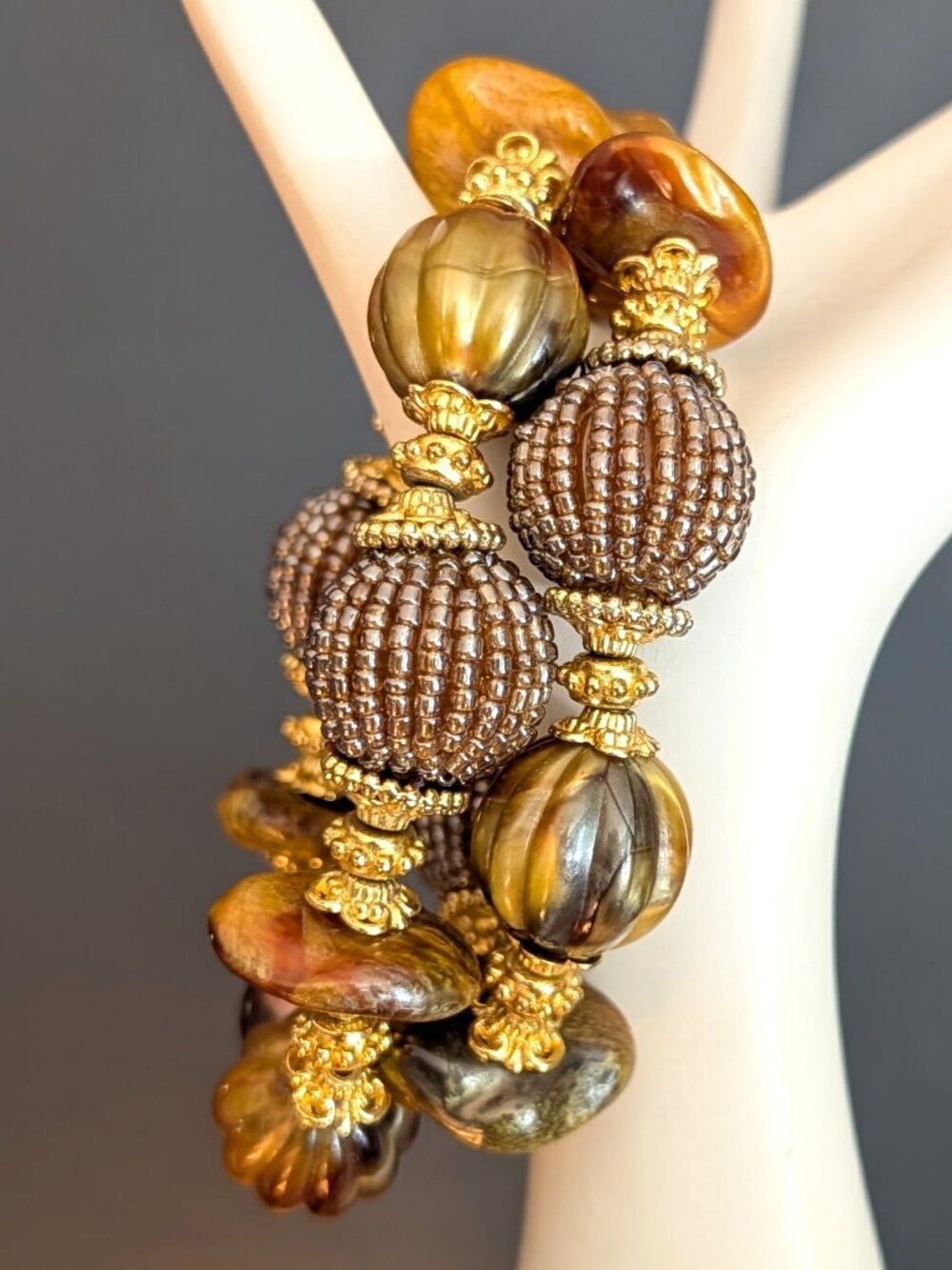 Pair of gold accented beaded stretch bracelets